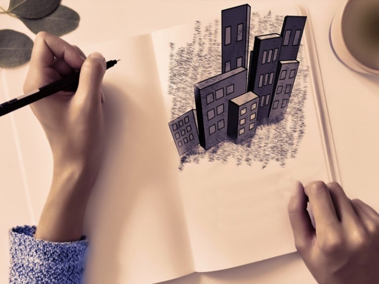 An image of an architect tracing an architectural design on a book before doing the nata exam